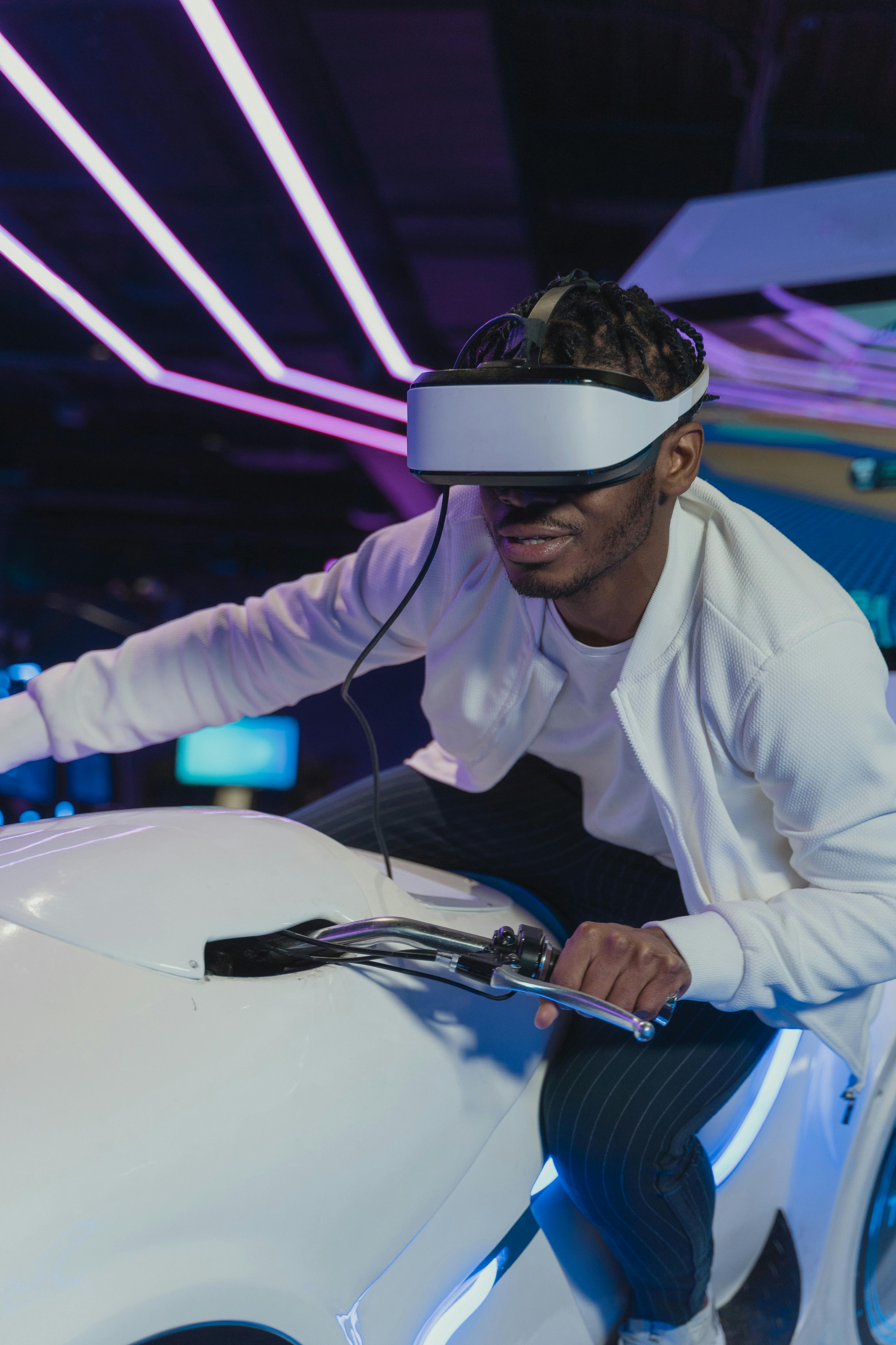 Black man immersed in virtual reality gaming with VR headset in a neon-lit arcade.
